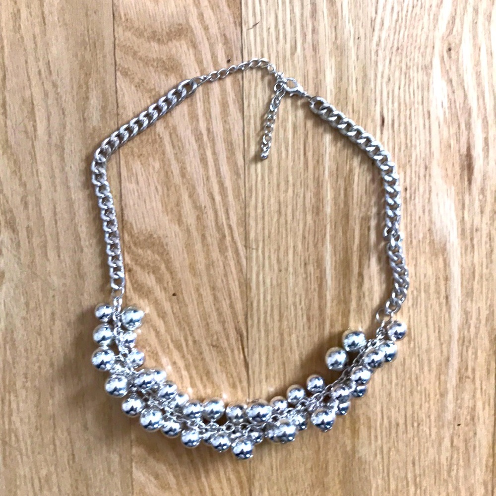 Silver tone necklace with silver tone beads. Never worn.